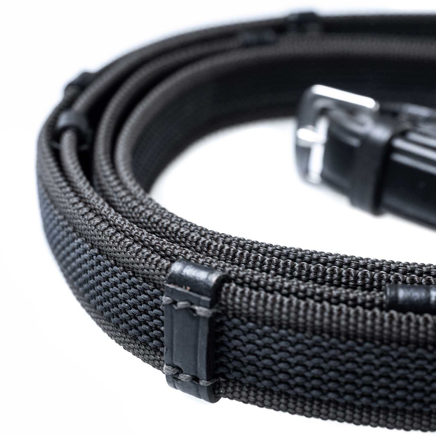 Black Sure Grip reins with continental stoppers, made from English leather
