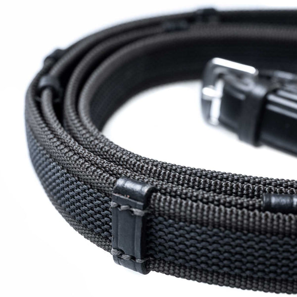 Black Sure Grip reins with continental stoppers, made from English leather